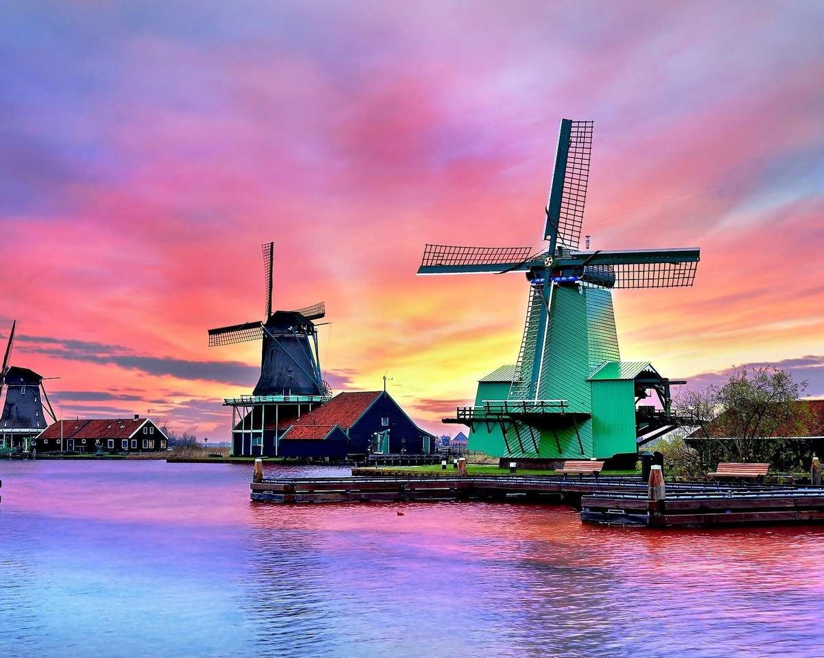 Windmolens op de rivier bij zonsondergang in Nederland legpuzzel online