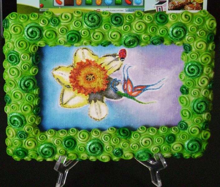 blomma, fjäril och nyckelpiga med dekorerad ram Pussel online