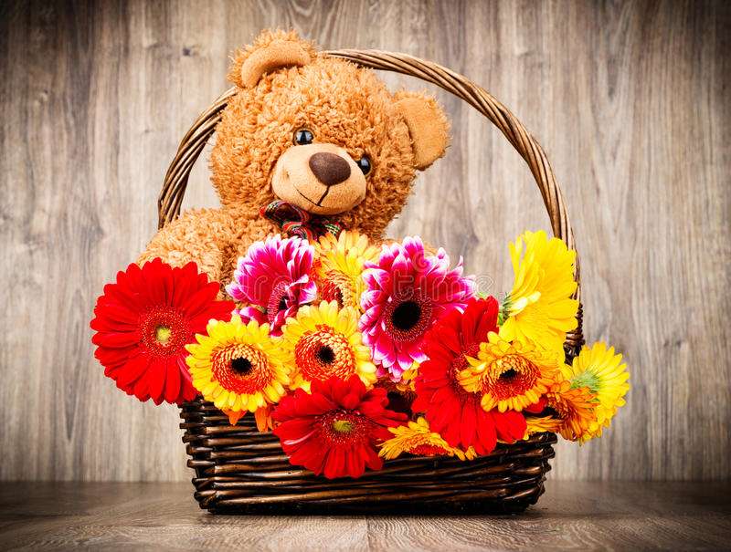 Flowers with a teddy bear as a gift jigsaw puzzle online