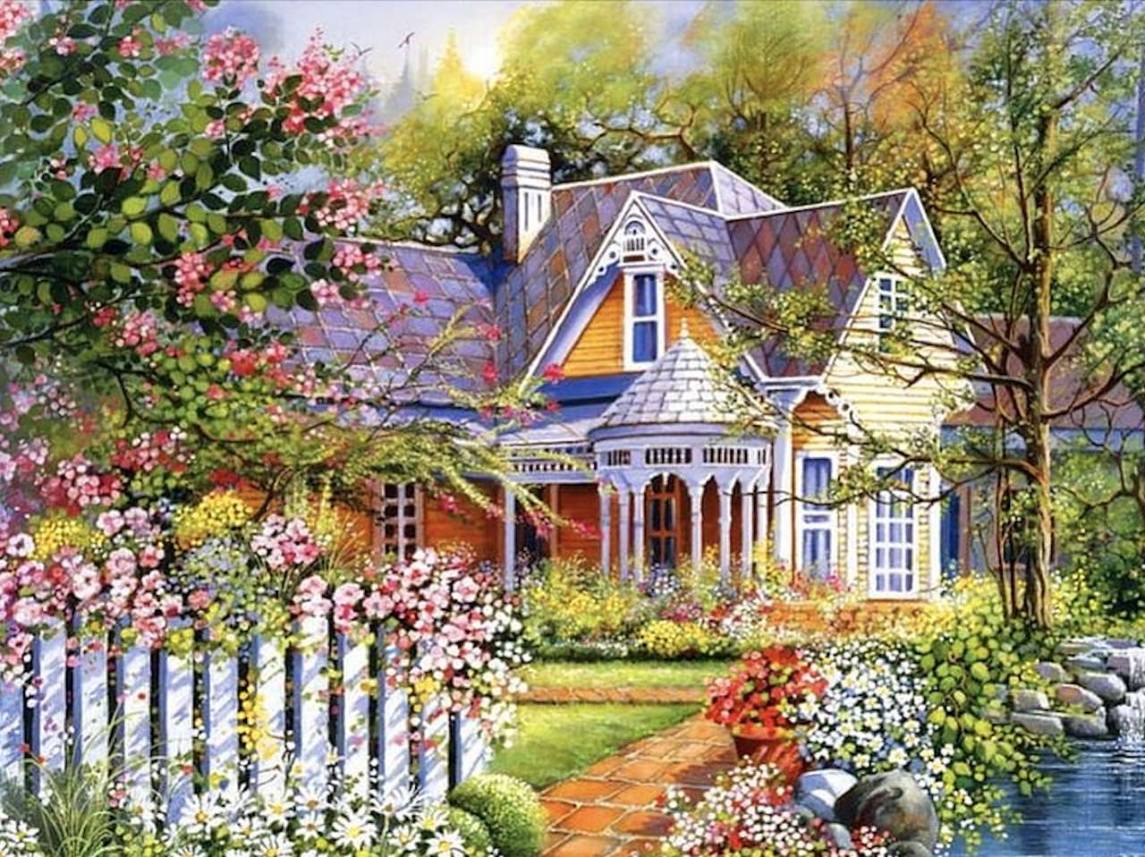 O frumoasă casă de țară galbenă cu un gard alb jigsaw puzzle online
