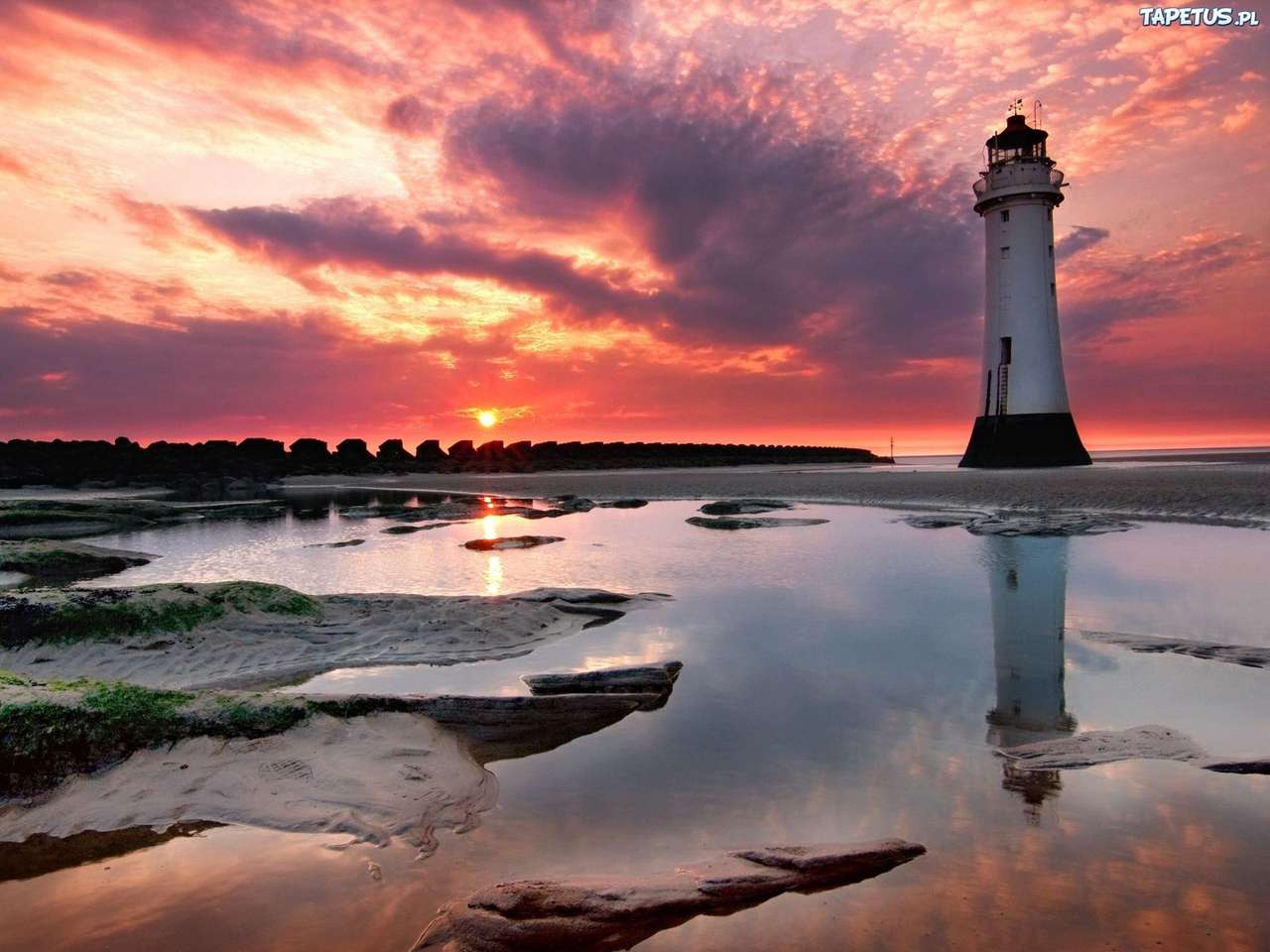 Sunset over the lighthouse jigsaw puzzle online