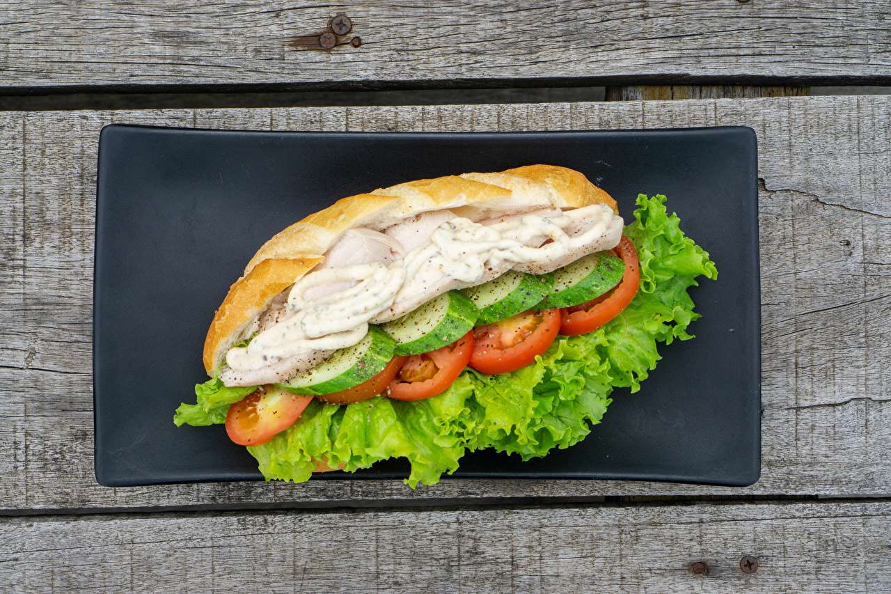 Hot dog bun with vegetables and chicken jigsaw puzzle online