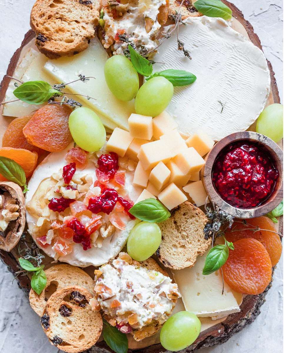Cheeses, breads, grapes, jam jigsaw puzzle online