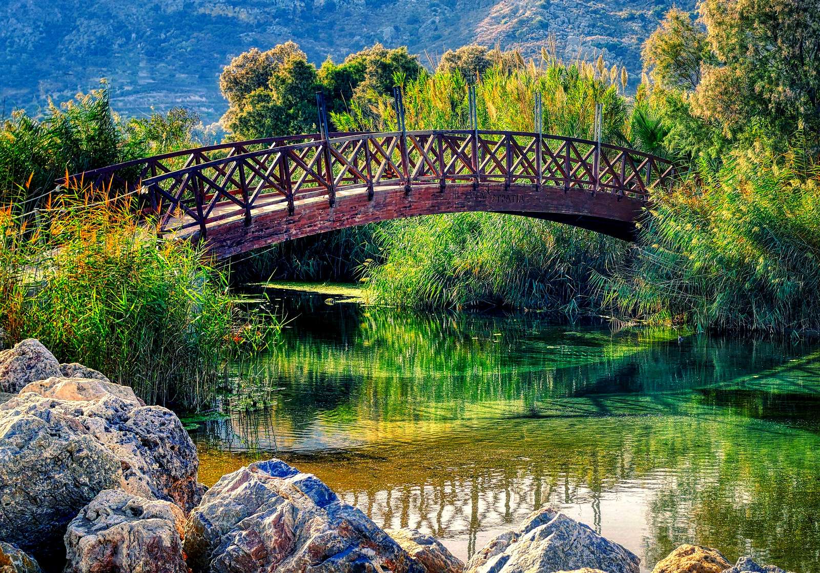 Wooden bridge in a mountain park online puzzle