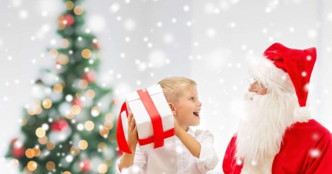 barn och jultomten med vita presenter Pussel online