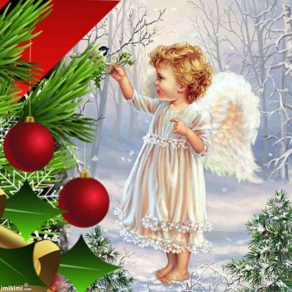 Un angelo vicino all'albero di Natale puzzle online