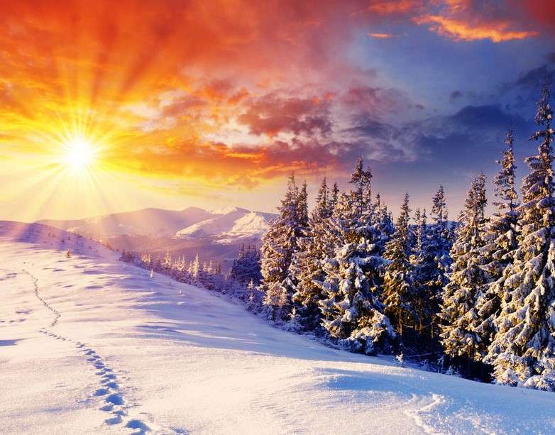 Nascer do sol em uma paisagem coberta de neve quebra-cabeças online