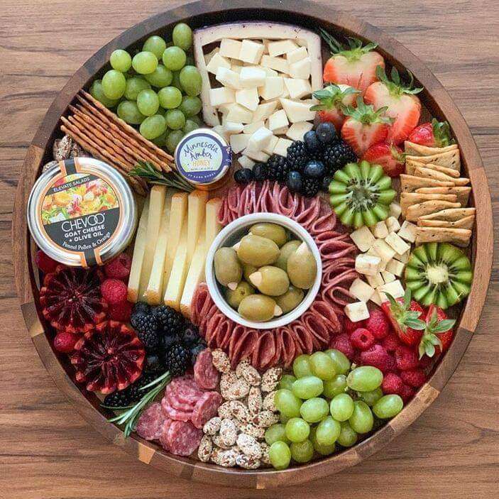 a bowl of snacks with wine, a movie or Netflix online puzzle