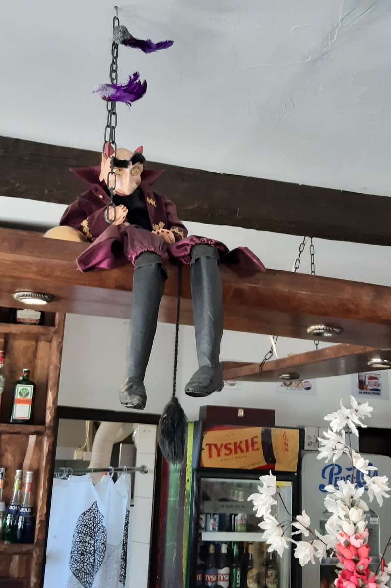 Devil puppet in a restaurant online puzzle