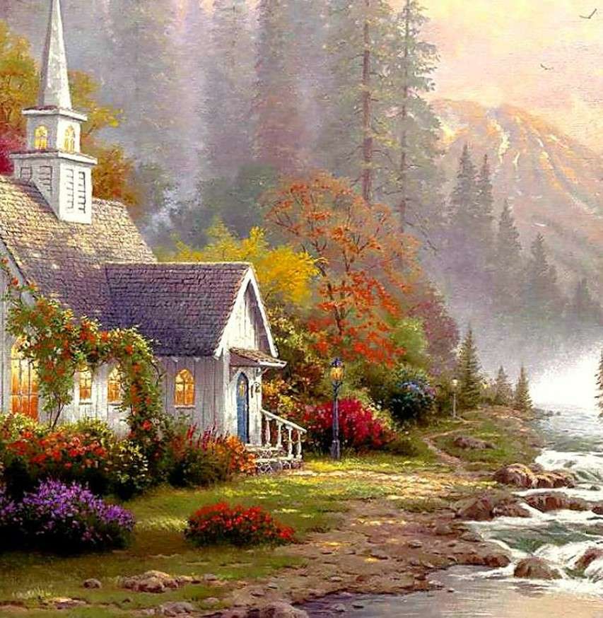 Una iglesia junto al río en las montañas. rompecabezas en línea