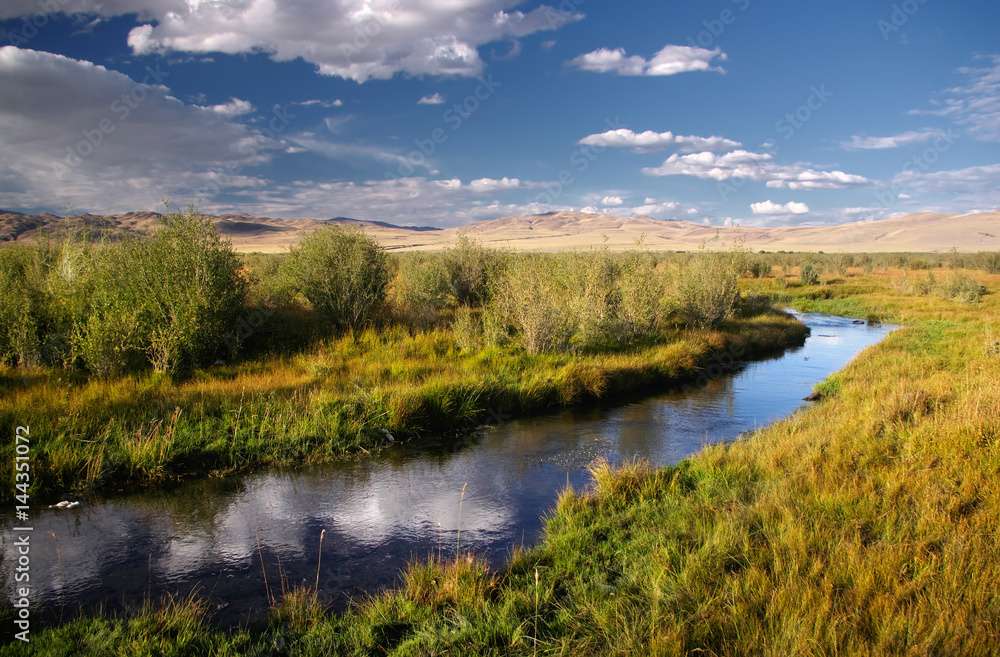River on a grassy plain jigsaw puzzle online