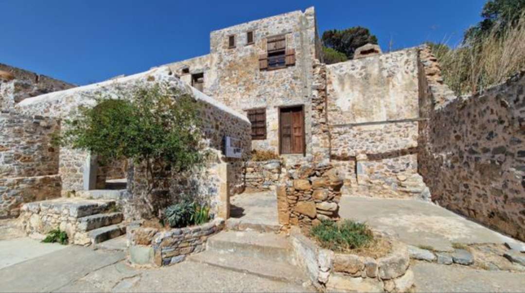 Casa con mattoni a vista in Grecia puzzle online