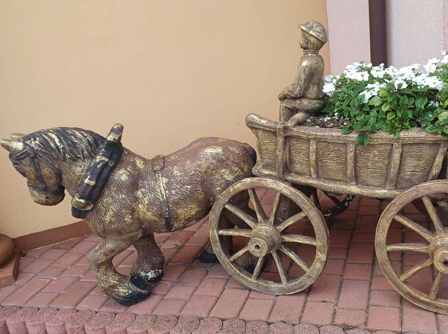 flowerbed and cart in the garden jigsaw puzzle online